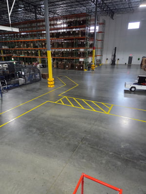 Warehouse floors marked for forklifts and pedestrians