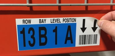 Repositionable warehouse rack label