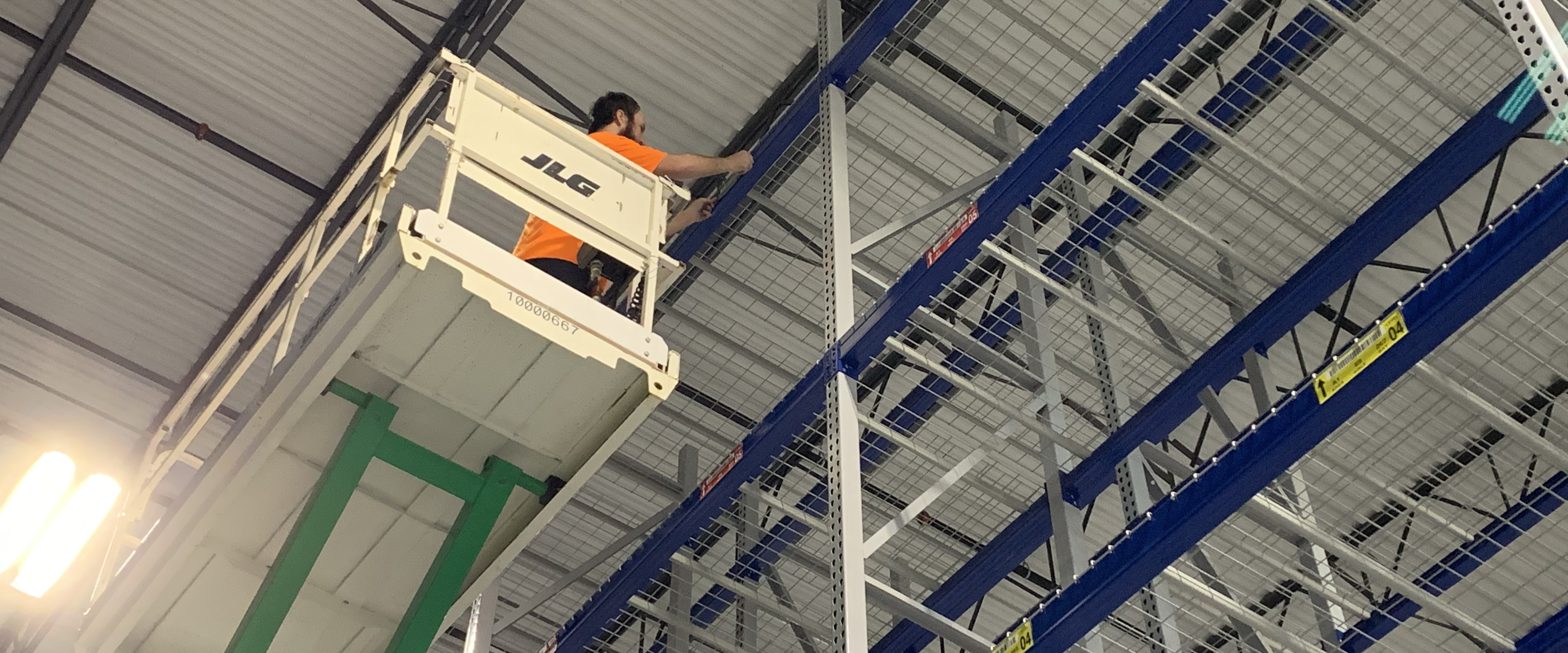 Label installer on scissor lift